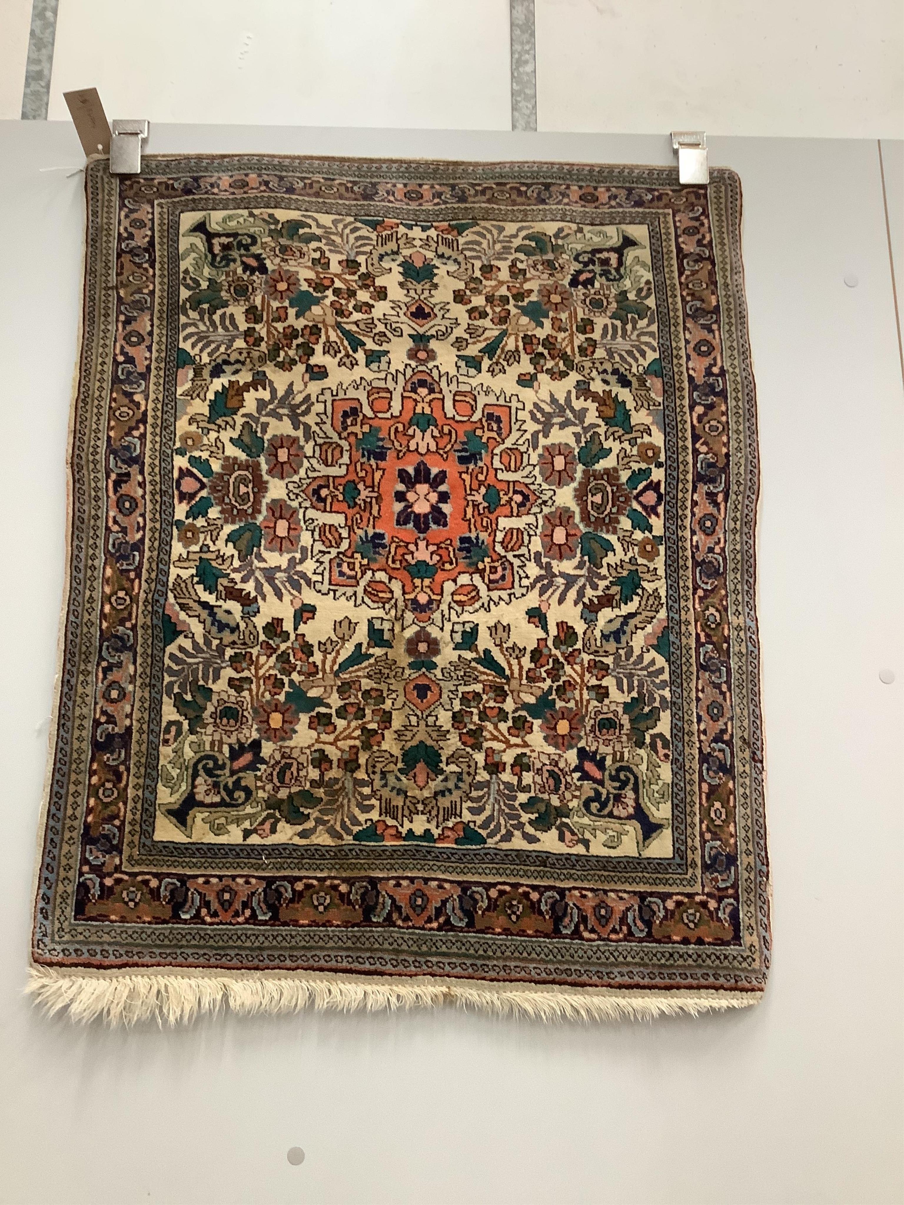 A North West Persian ivory ground mat, 86 x 70cm. Condition - fair